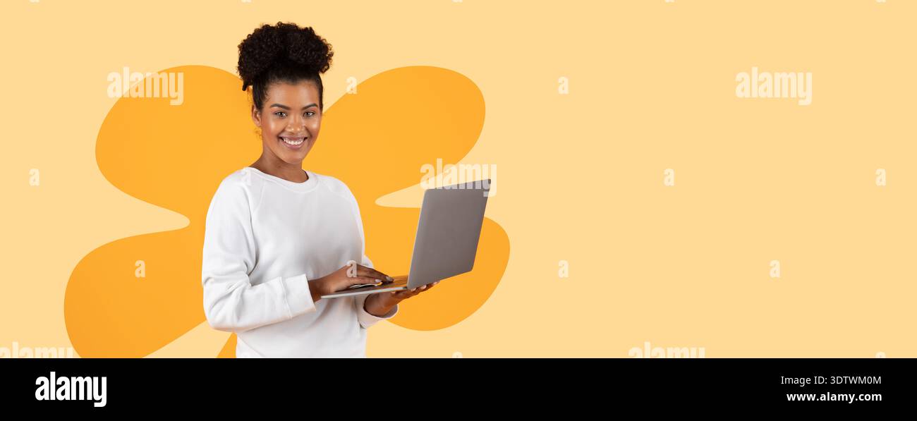 Collage of a Woman Smiling While Using a Laptop With a Colorful Background Stock Photo