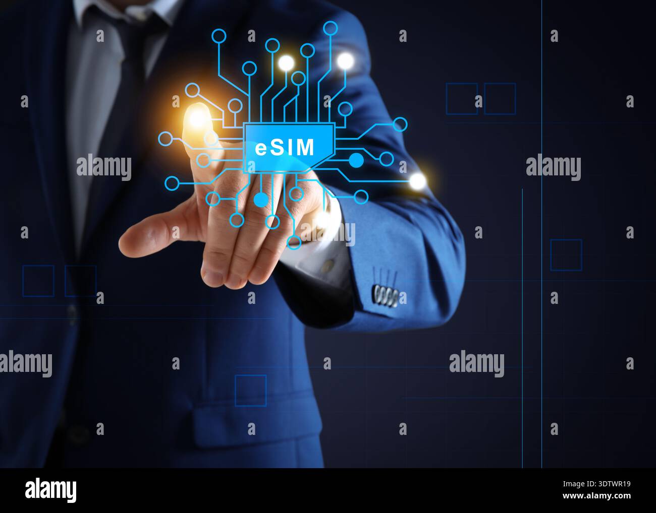 Businessman activating eSIM microchip on virtual screen, closeup. Dark background Stock Photo