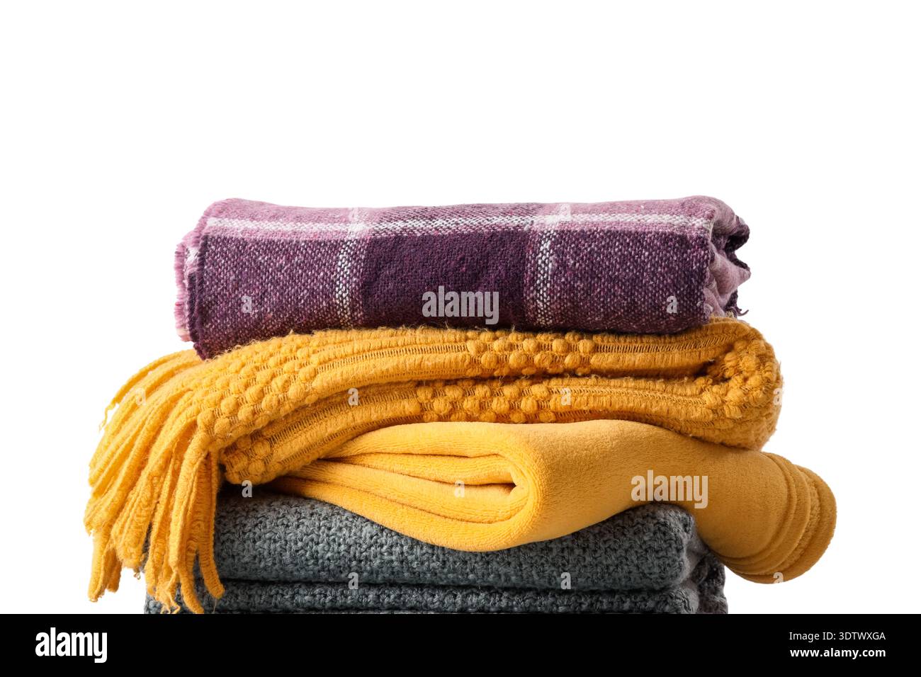 Stack of cozy blankets on white background, closeup Stock Photo