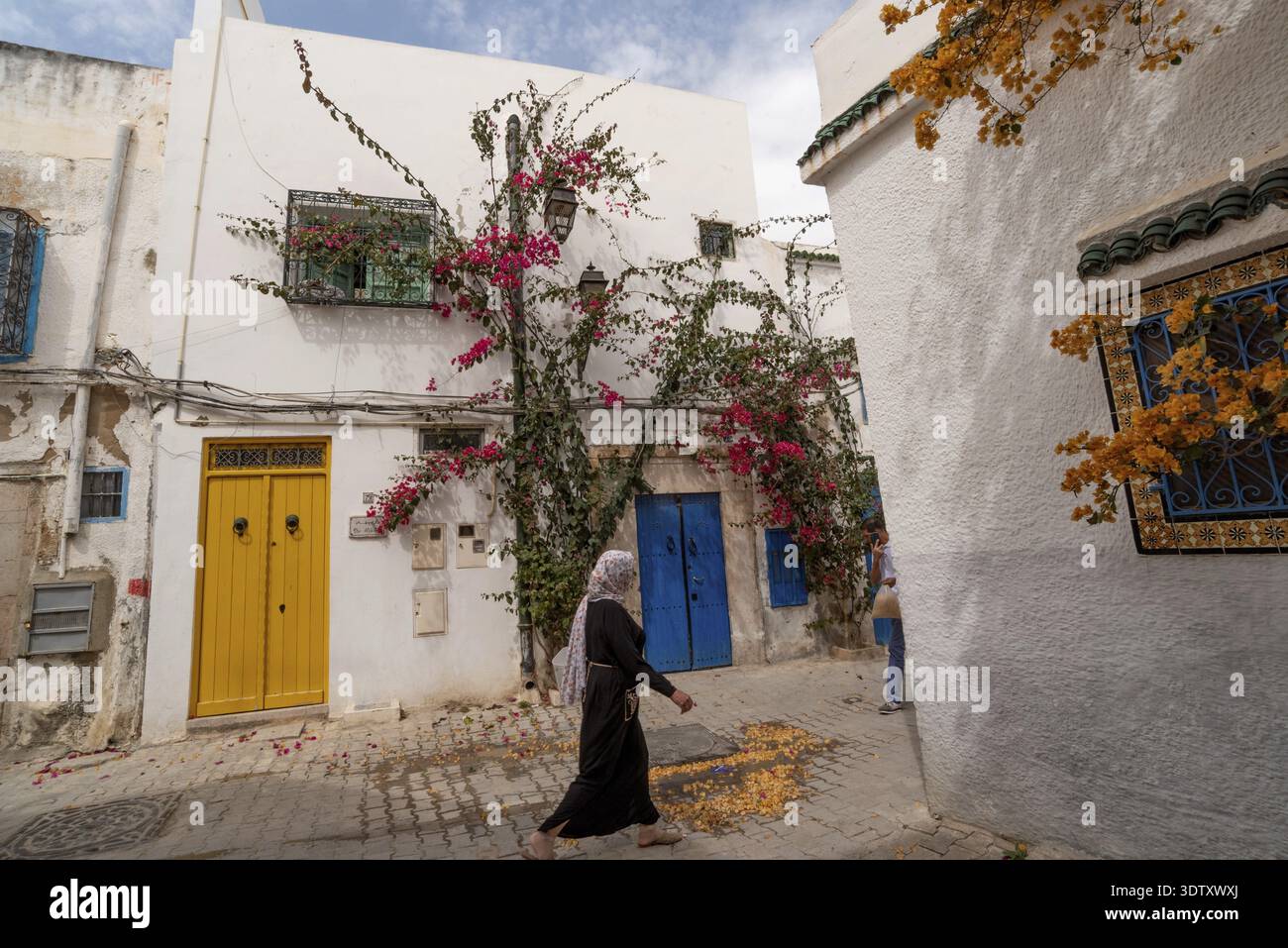 Tunis, Tunisia. 7th May 2024 Traditional blue and yellow doors of typical Tunisian architecture in the colourful alleyways of the Medina in Tunis, cap Stock Photo