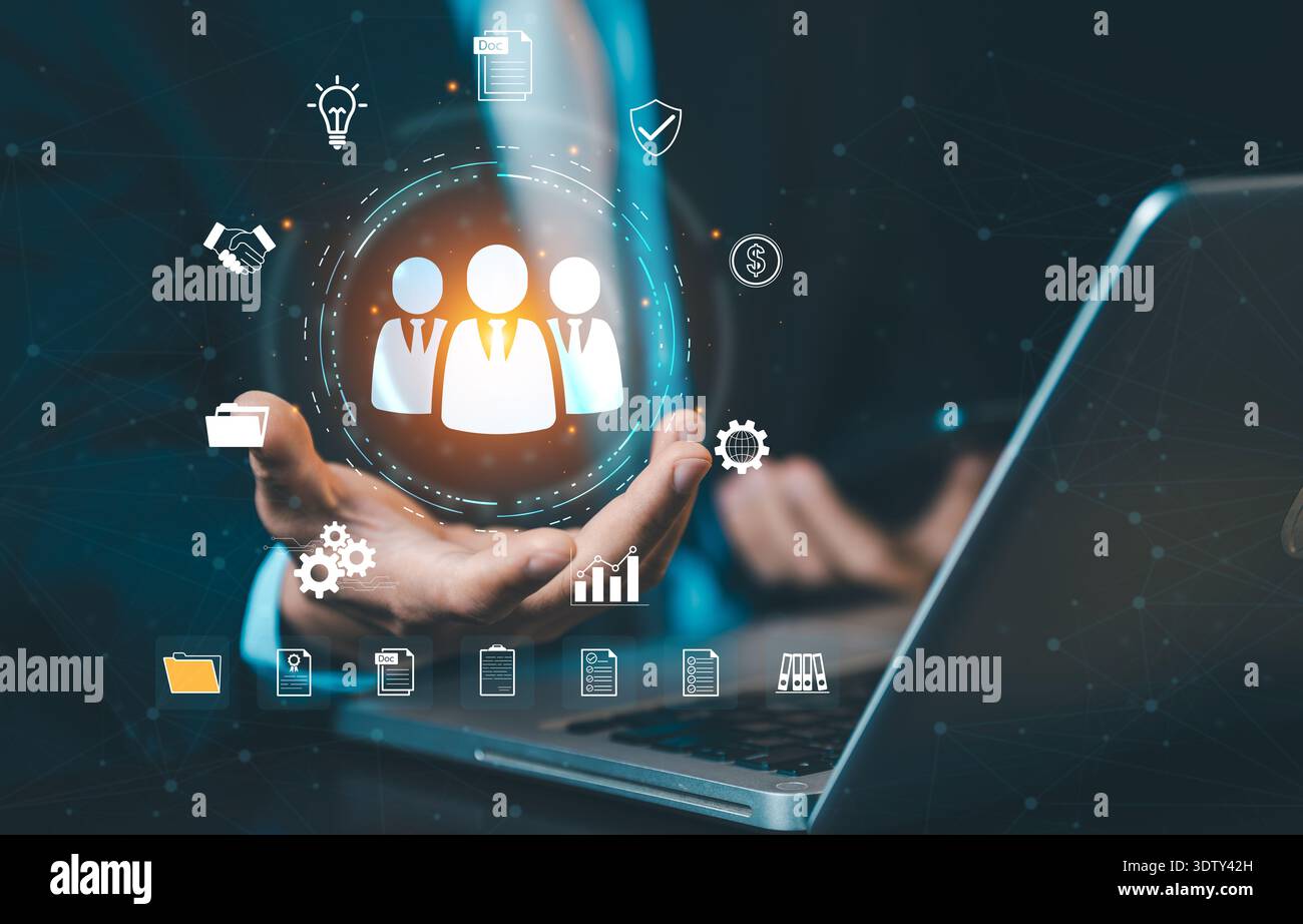 Businessman presenting HR management system on laptop. Concept of human resources, recruitment technology, digital workforce, and personnel management Stock Photo