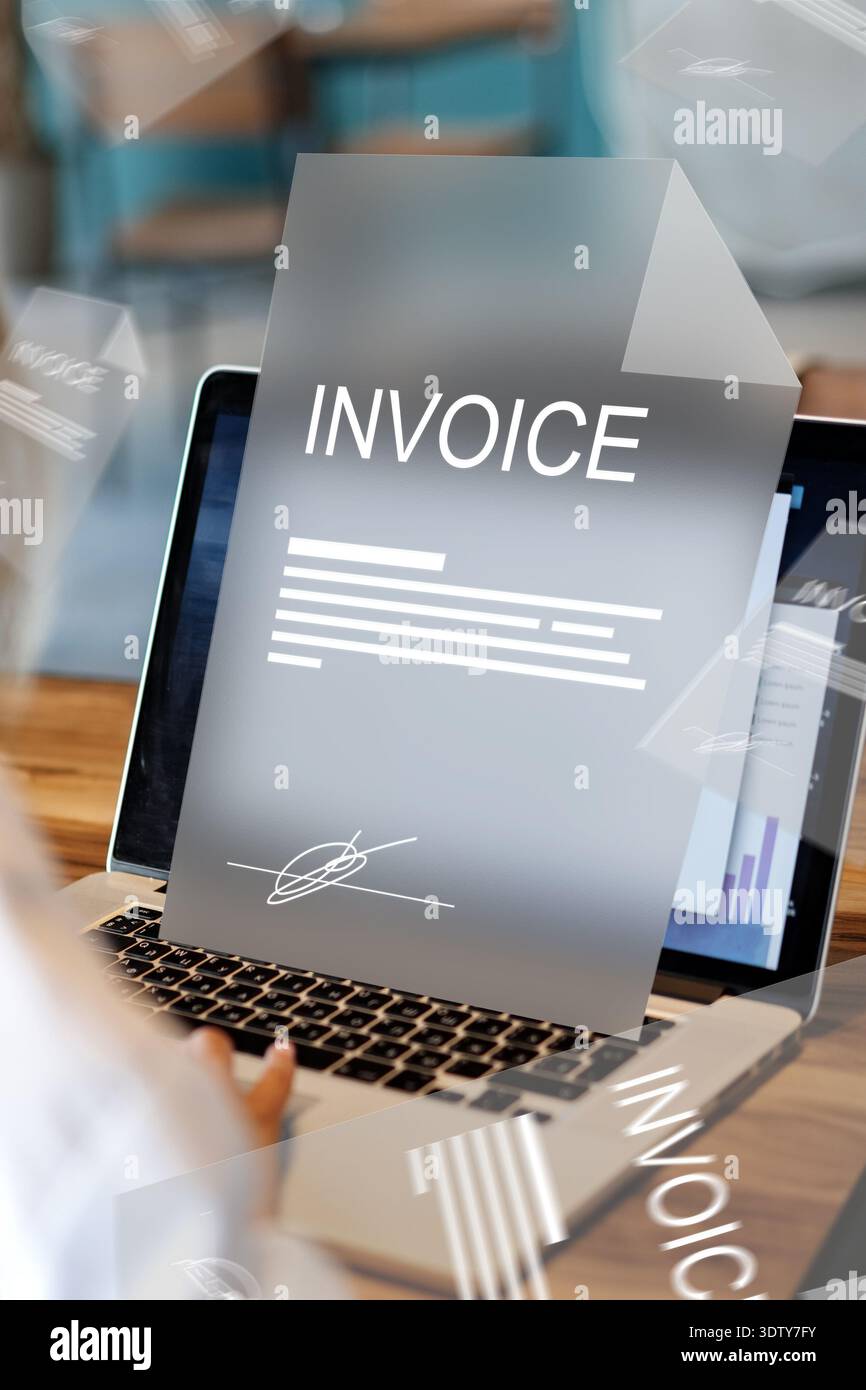 Banking invoice payment process on a laptop during daytime at a workspace Stock Photo