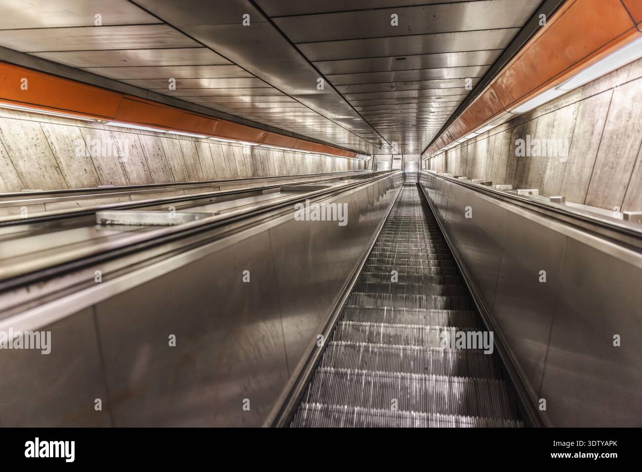 Empty subway escalator in underground metro station with perspective view Stock Photo