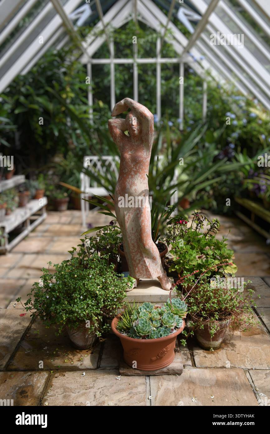 Terracotta statue in greenhouse Stock Photo