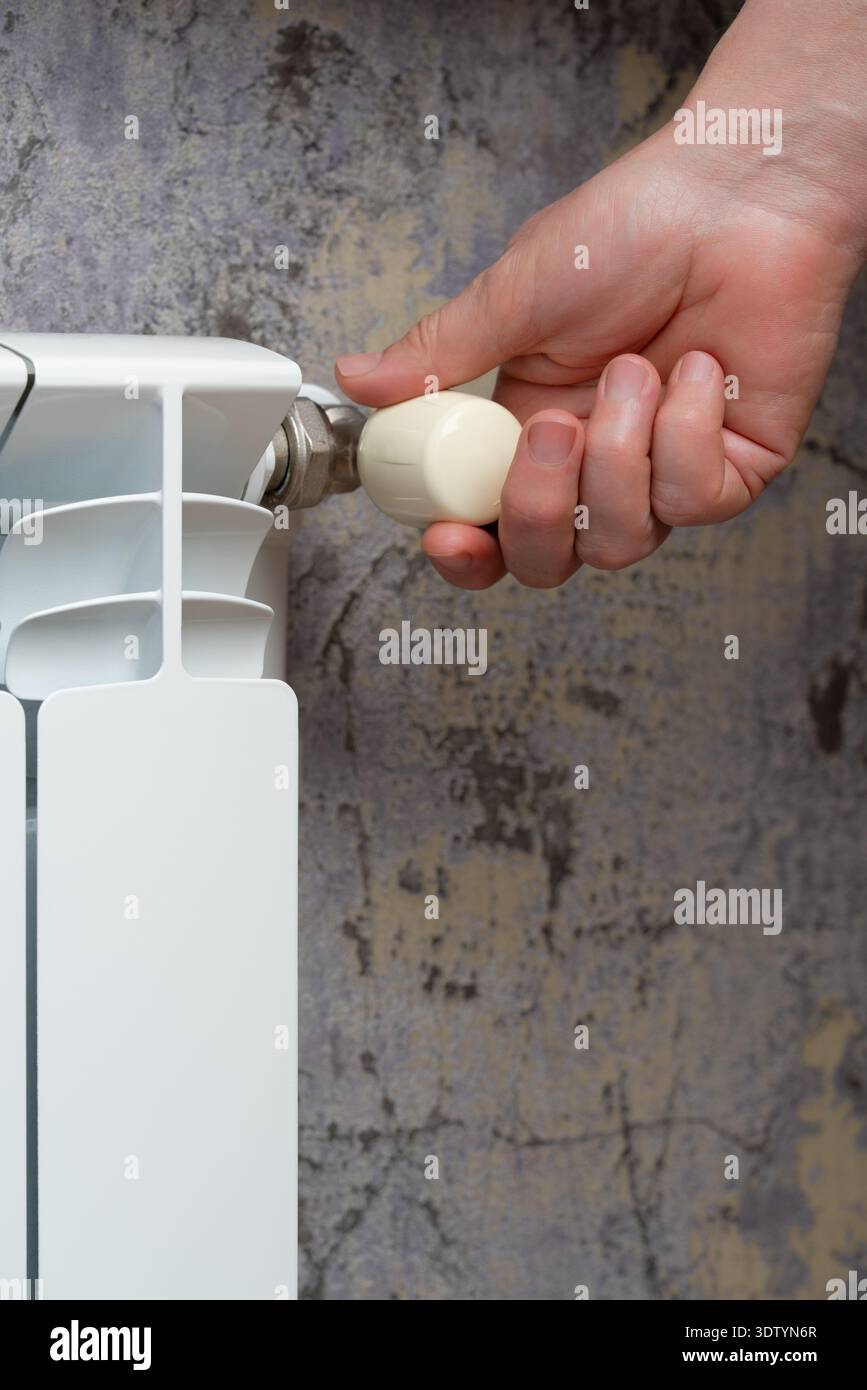 Human hand turns valve hi-res stock photography and images - Alamy