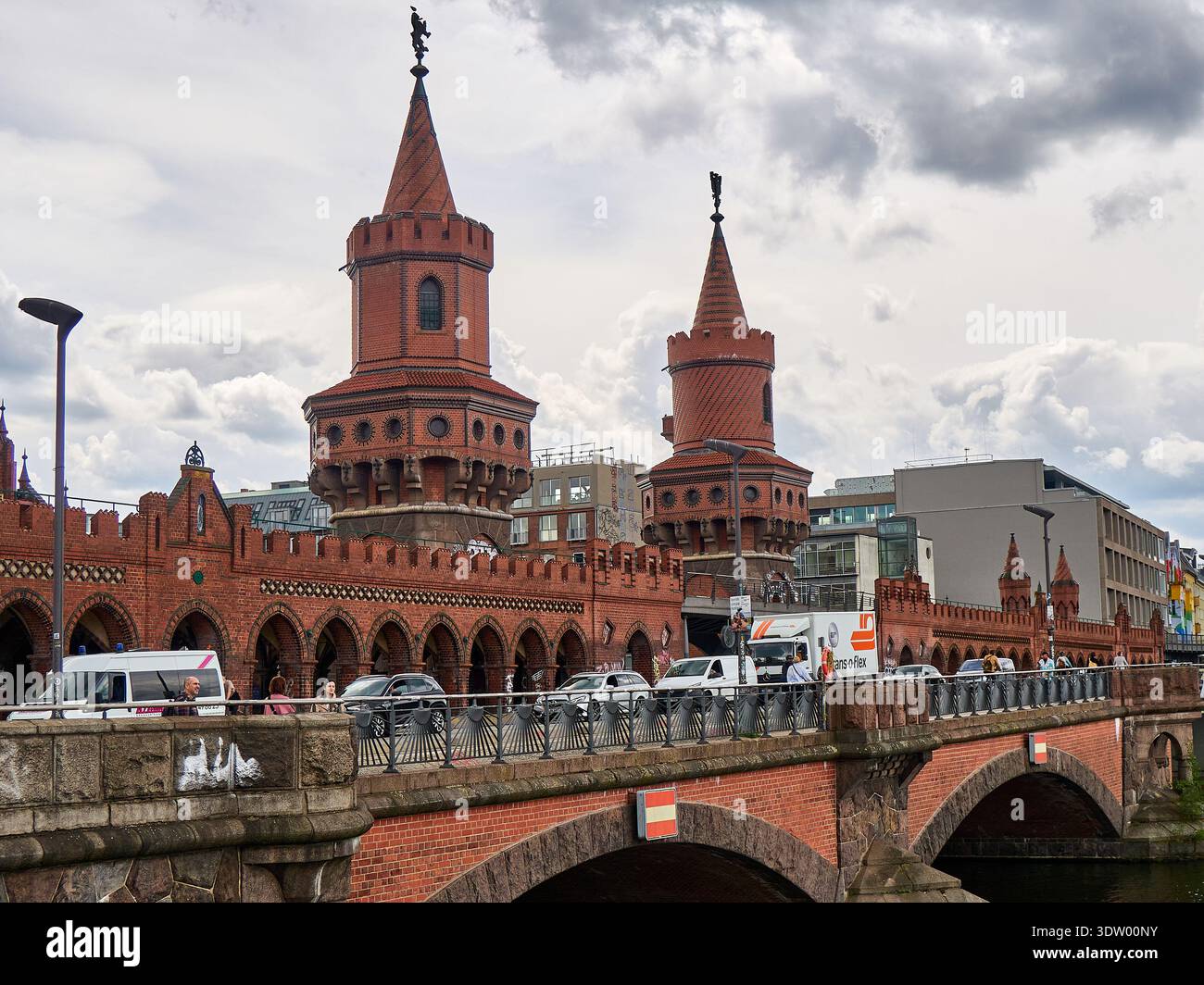 Berlin Oberbaum Bridge with Yellow U-Bahn Train over Spree River Stock Photo