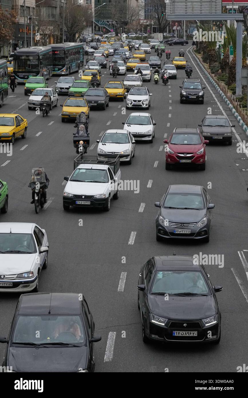 Tehran Driving Vehicles drive in a square in downtown Tehran, Iran, Tuesday, Feb. 24 ...