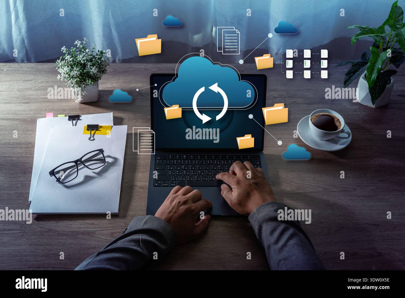 Cloud Storage Data Synchronization File Management on Laptop cloud storage and data synchronization icons representing business technology and remote Stock Photo