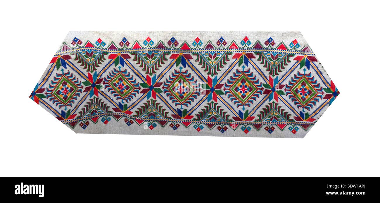 Detail of an embroidered ornament with colored threads on white fabric, Ukrainian folk embroidery, close-up. Stock Photo