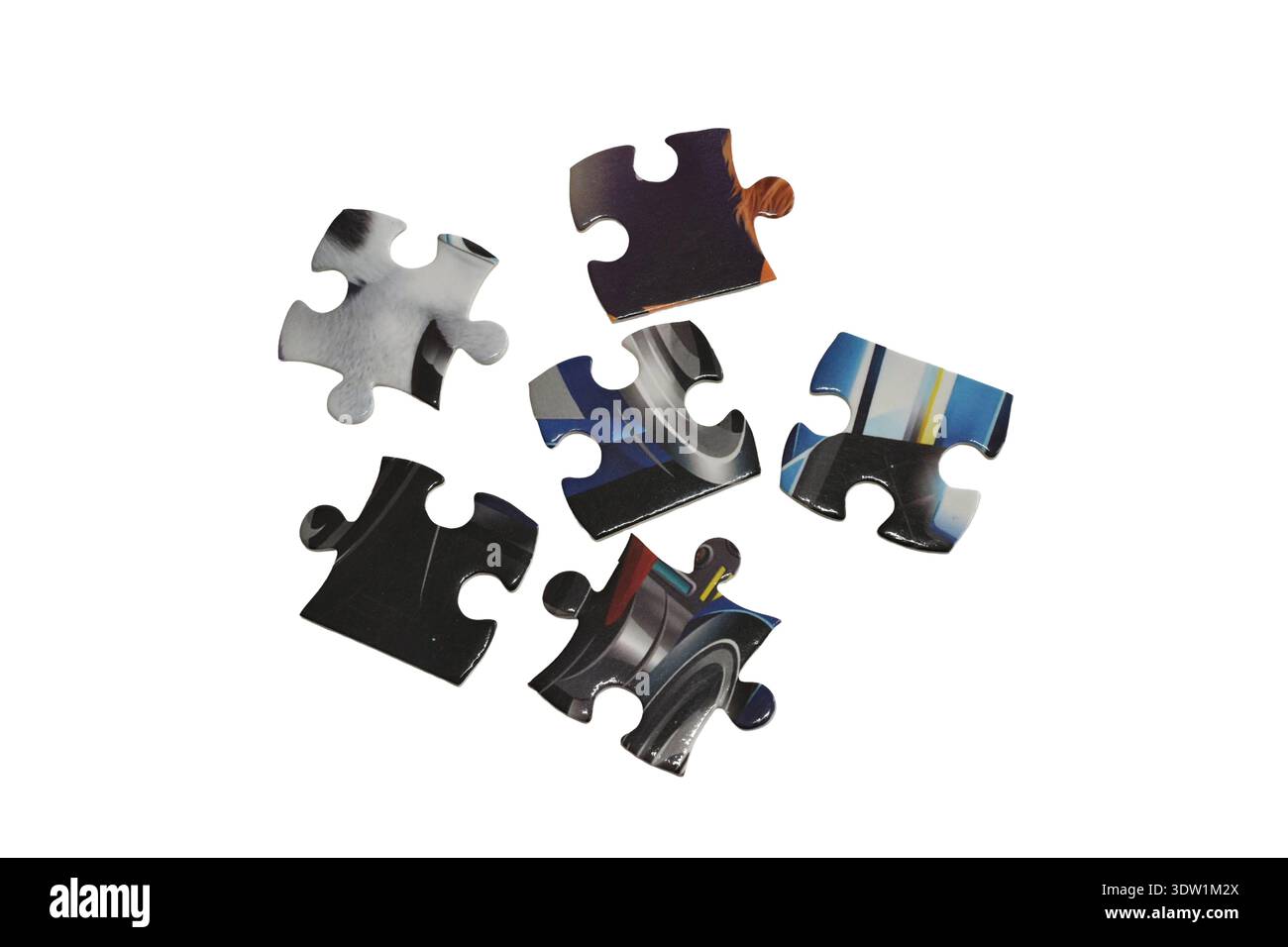 Individual puzzles are randomly isolated on a white background. Stock Photo