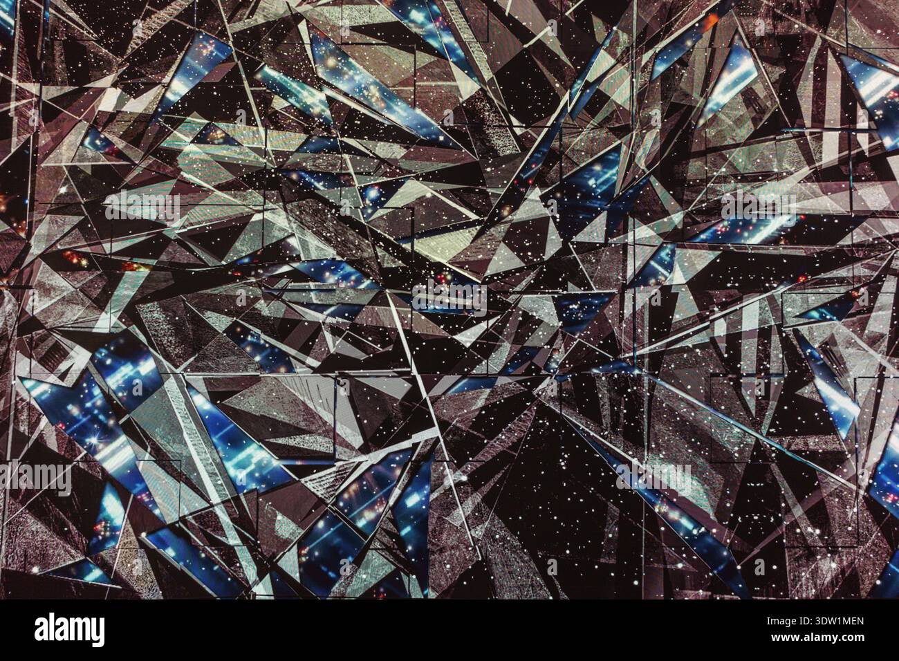 Abstract background featuring shattered glass shards with complex geometric reflections and metallic textures. Stock Photo