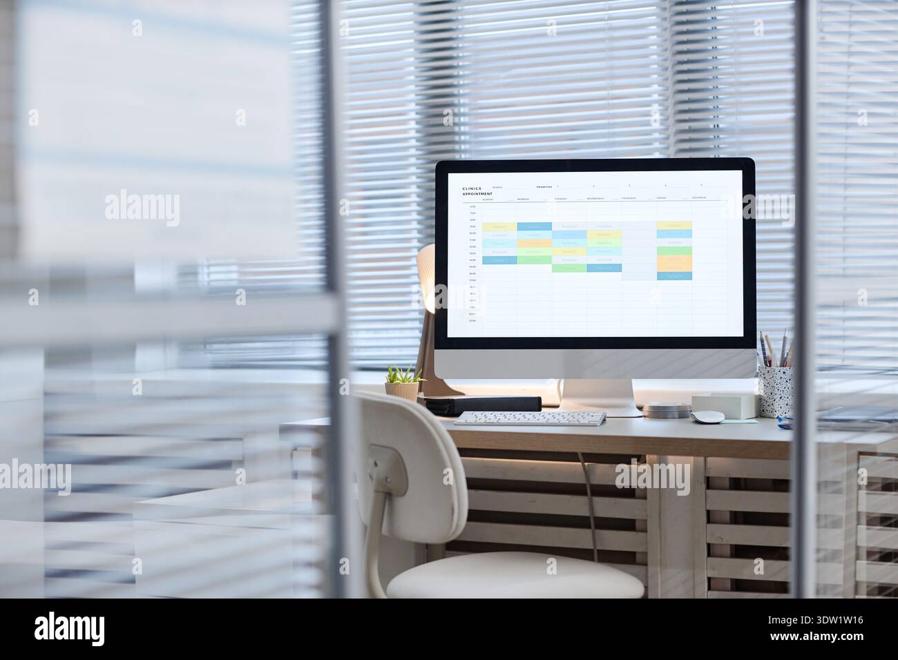 Modern Office Desk Featuring Computer Monitor Displaying Digital ...