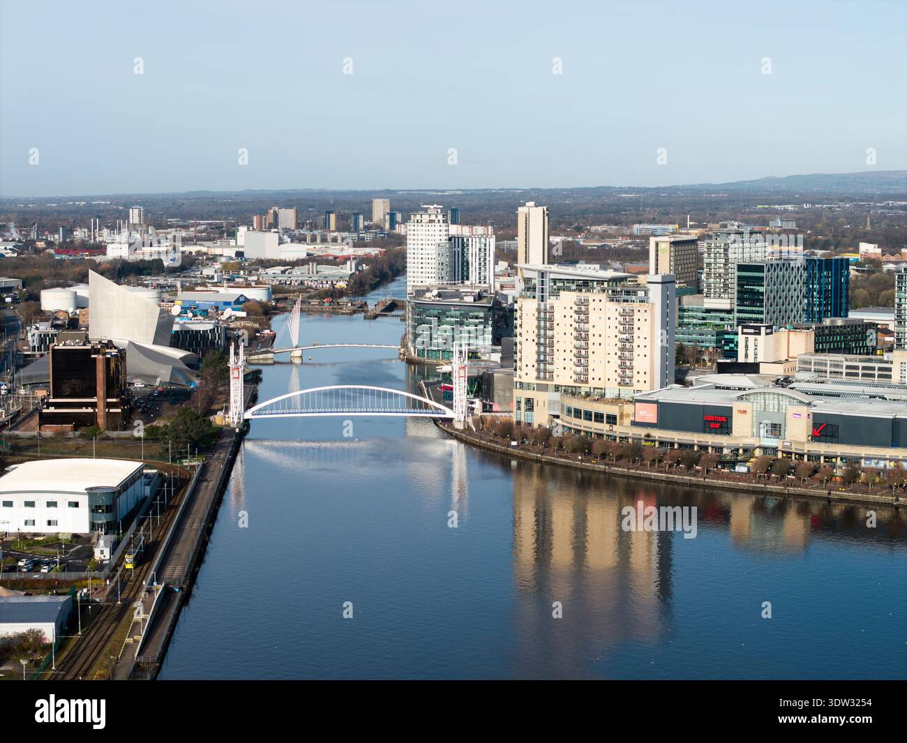 MANCHESTER, ENGLAND: FEBRUARY 17, 2026: Aerial view of Millennium Bridge footbridge and modern quayside buildings at Salford Quays Stock Photo