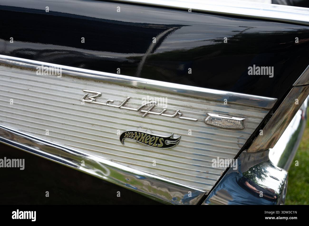 Extreme close-up of the rear tail fin of a black 1957 Chevrolet Bel Air ...