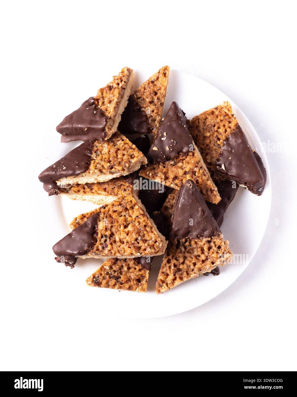 Top view walnut and coconut corners cookies dipped in white chocolate Stock Photo