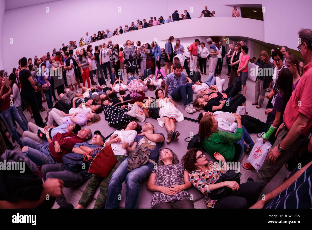 Visitors lie on the floor of the iconic Guggenheim Museum rotunda to ...