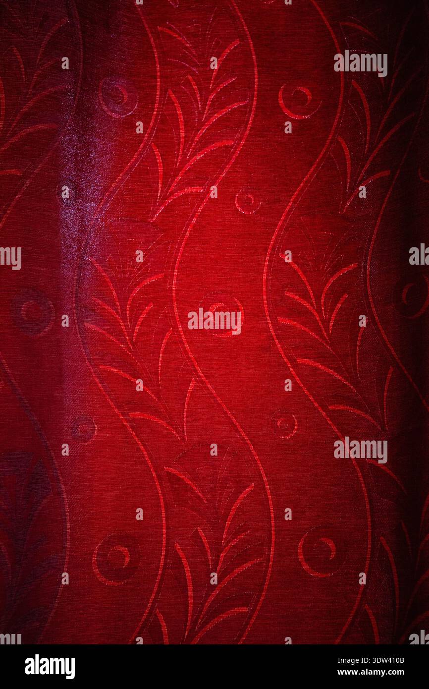 Intricate red fabric design with elegant patterns. Stock Photo