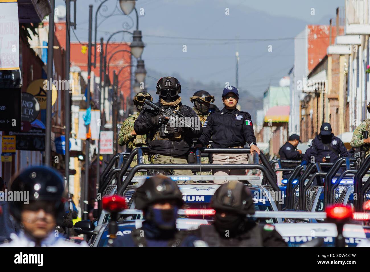 Municipal police and armed tactical forces patrolling in official ...