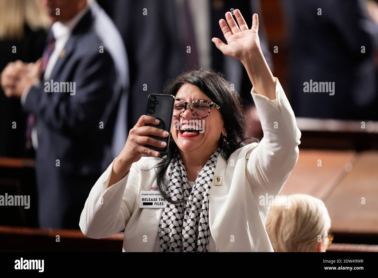 Rep. Rashida Tlaib, D-Mich., is seen before President Donald Trump ...