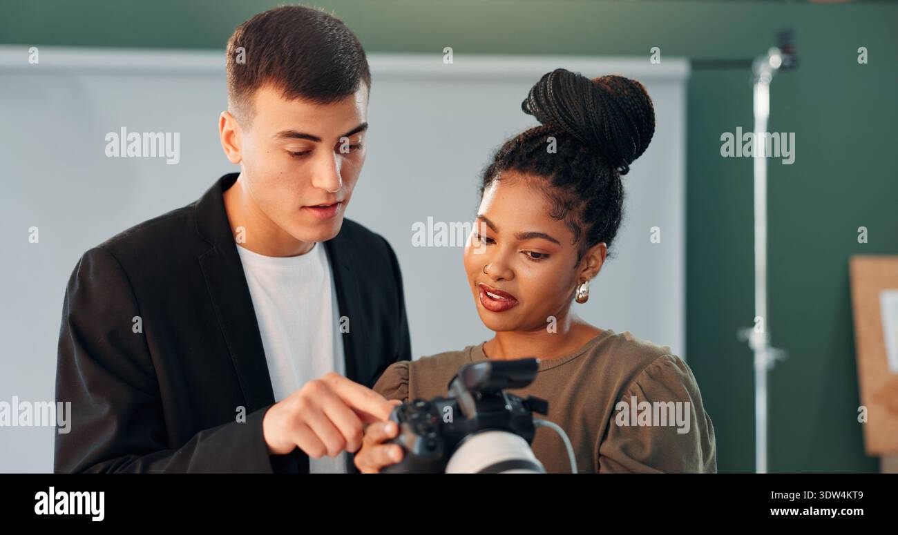 Conversation, photographer and model with camera in studio, review image and tips for expression check. Photography, tech or people with discussion Stock Photo