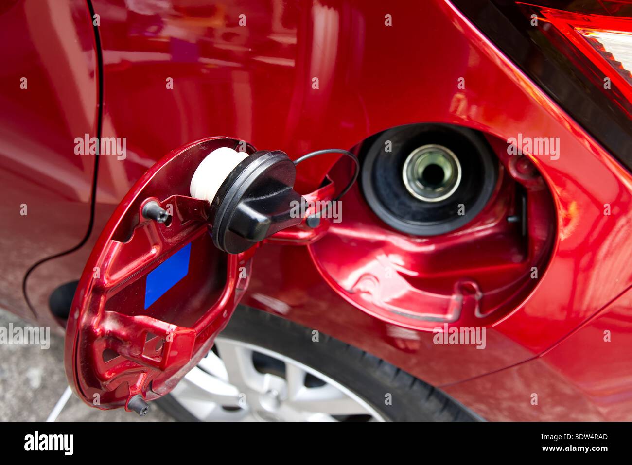 Car Fuel Tank Inlet, The fuel door of a red car is open, revealing the ...