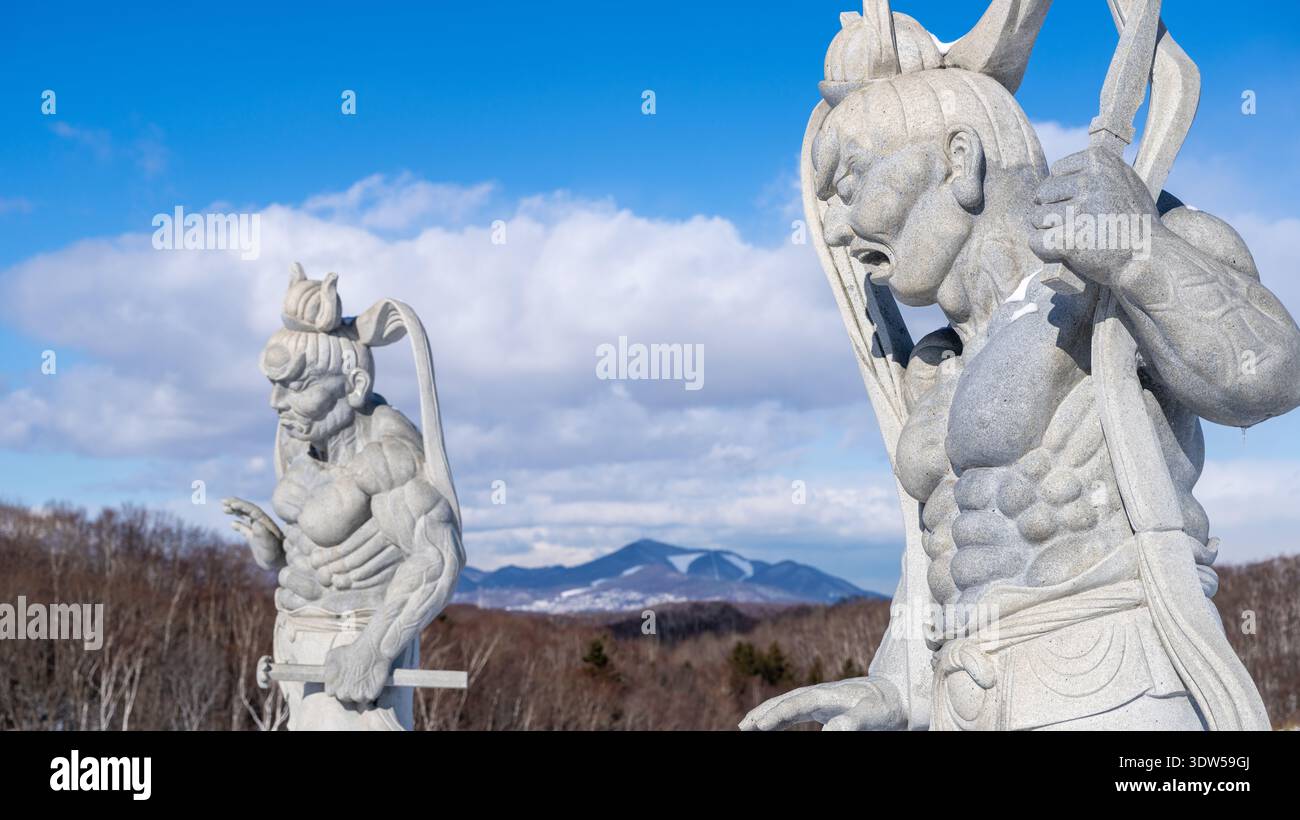 Japanese Nio guardian statue under a clear blue sky at Makomanai