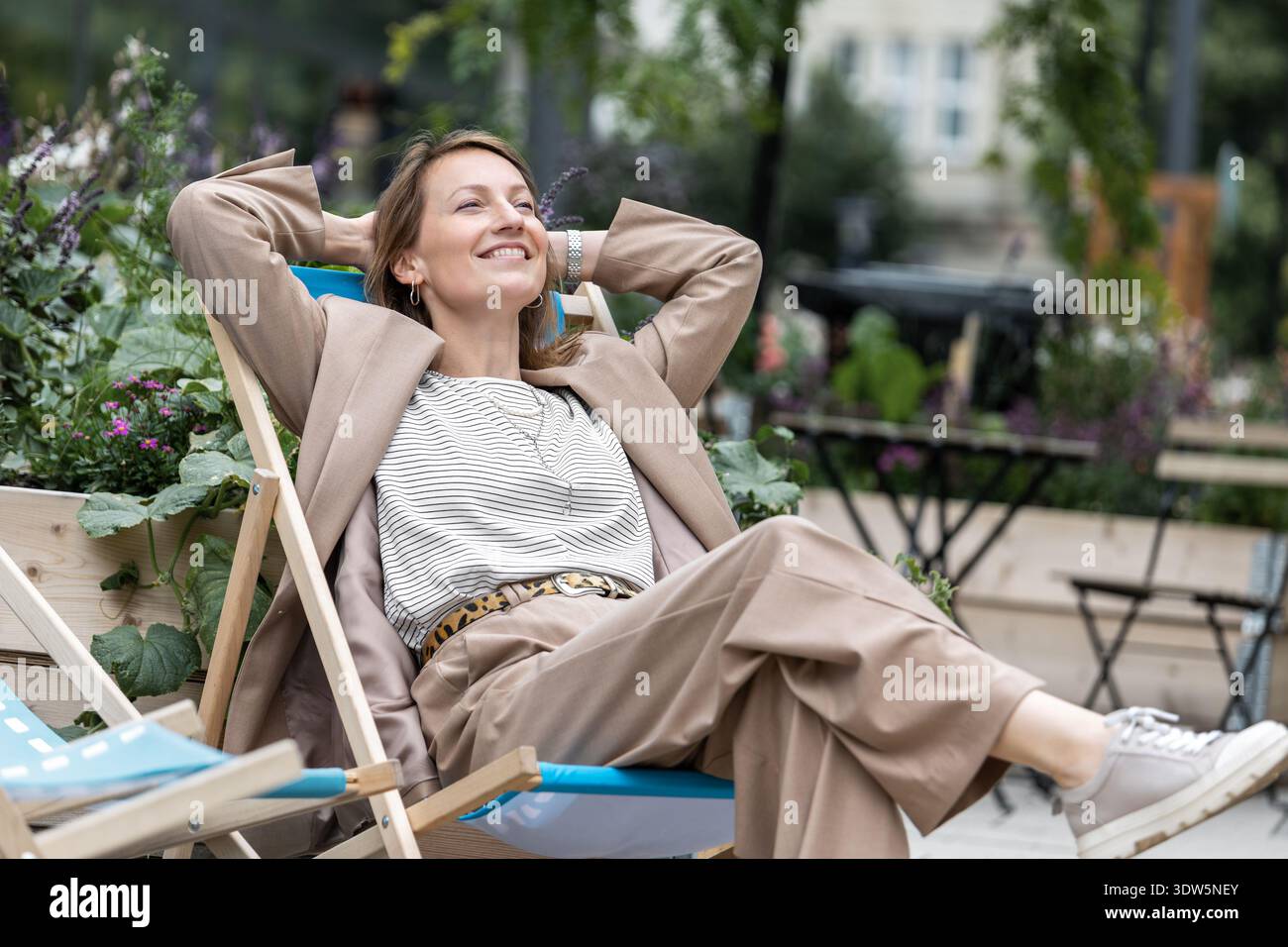 sachin and babi light blue dress Portrait of young adult mid age businesswoman in formal dress suit  outdoors. Happy confident stylish elegant business woman female person.  Financial Stock Photo