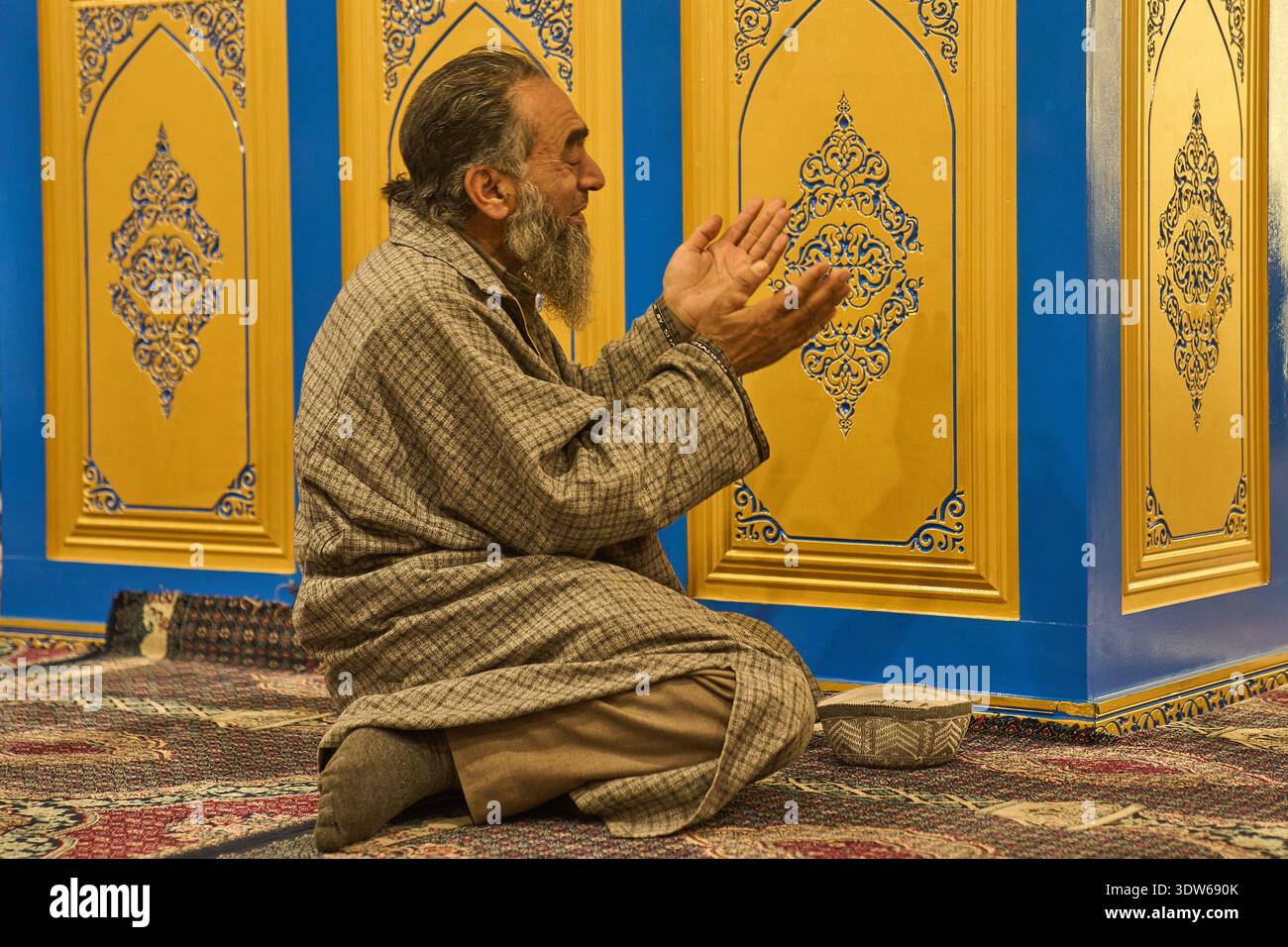 A Kashmiri Muslim man prays inside the Hazratbal Shrine, which houses a ...