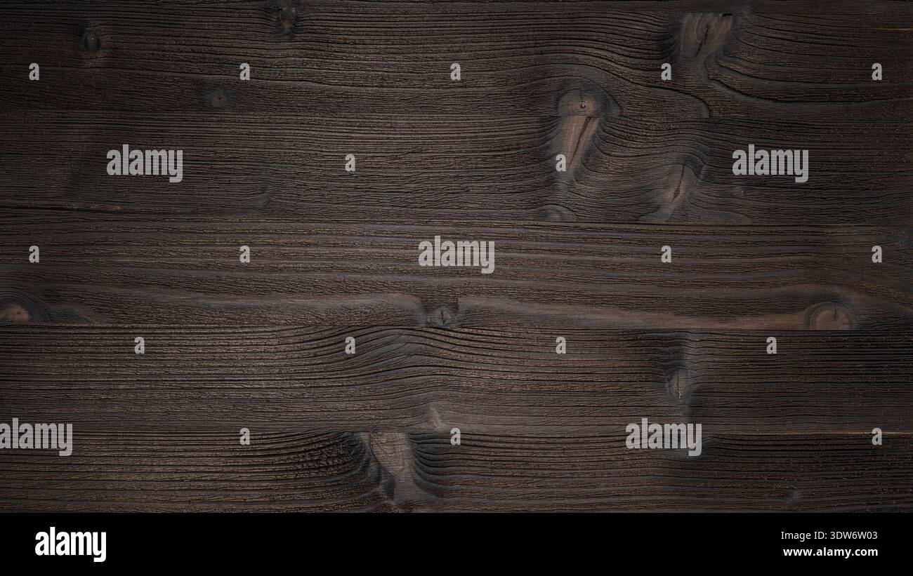 Aged dark brown wooden texture as background with copy space. Stained natural wooden board Stock Photo