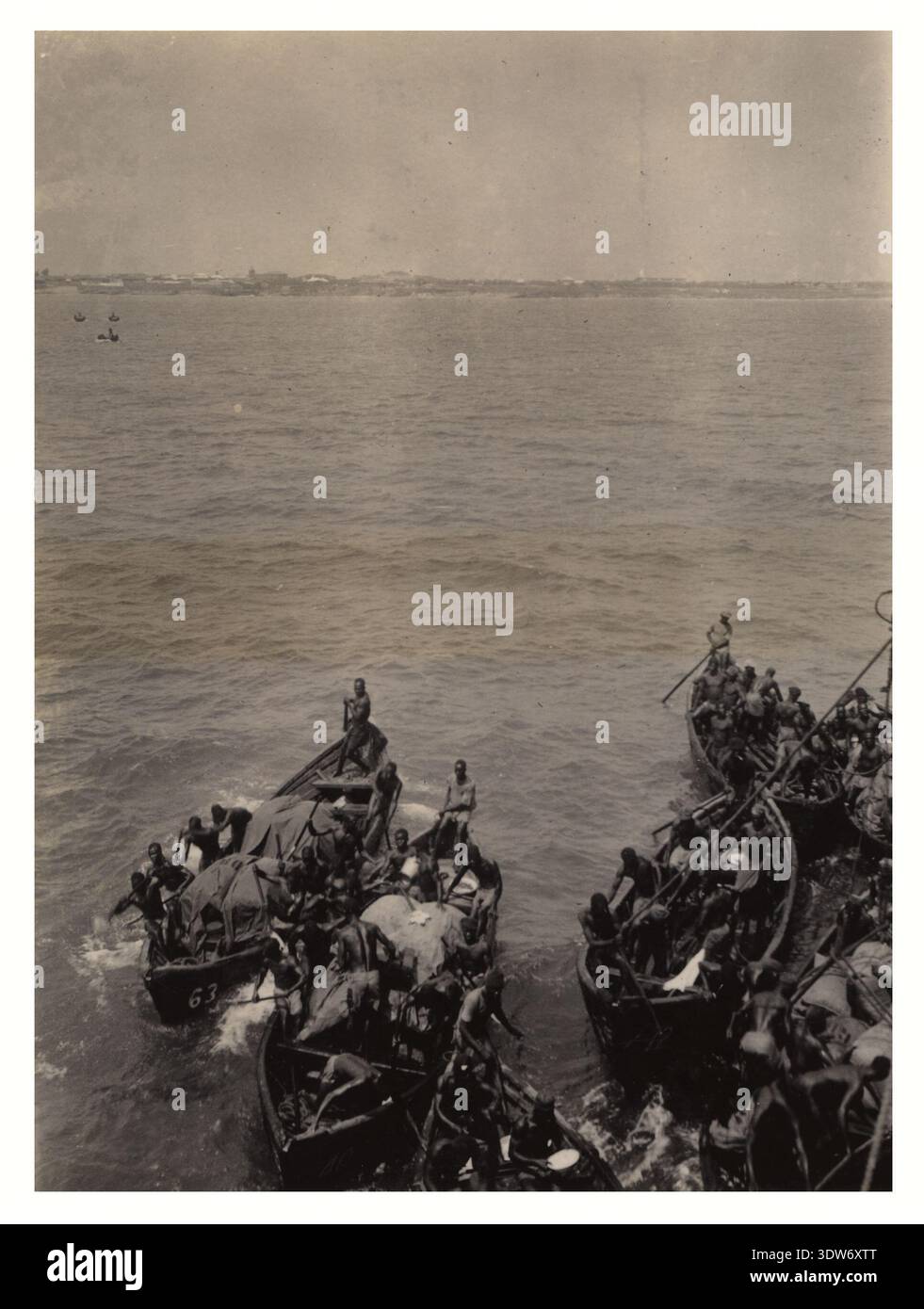 Boats transporting cocoa off the shore of Accra, Gold Coast (now Ghana ...
