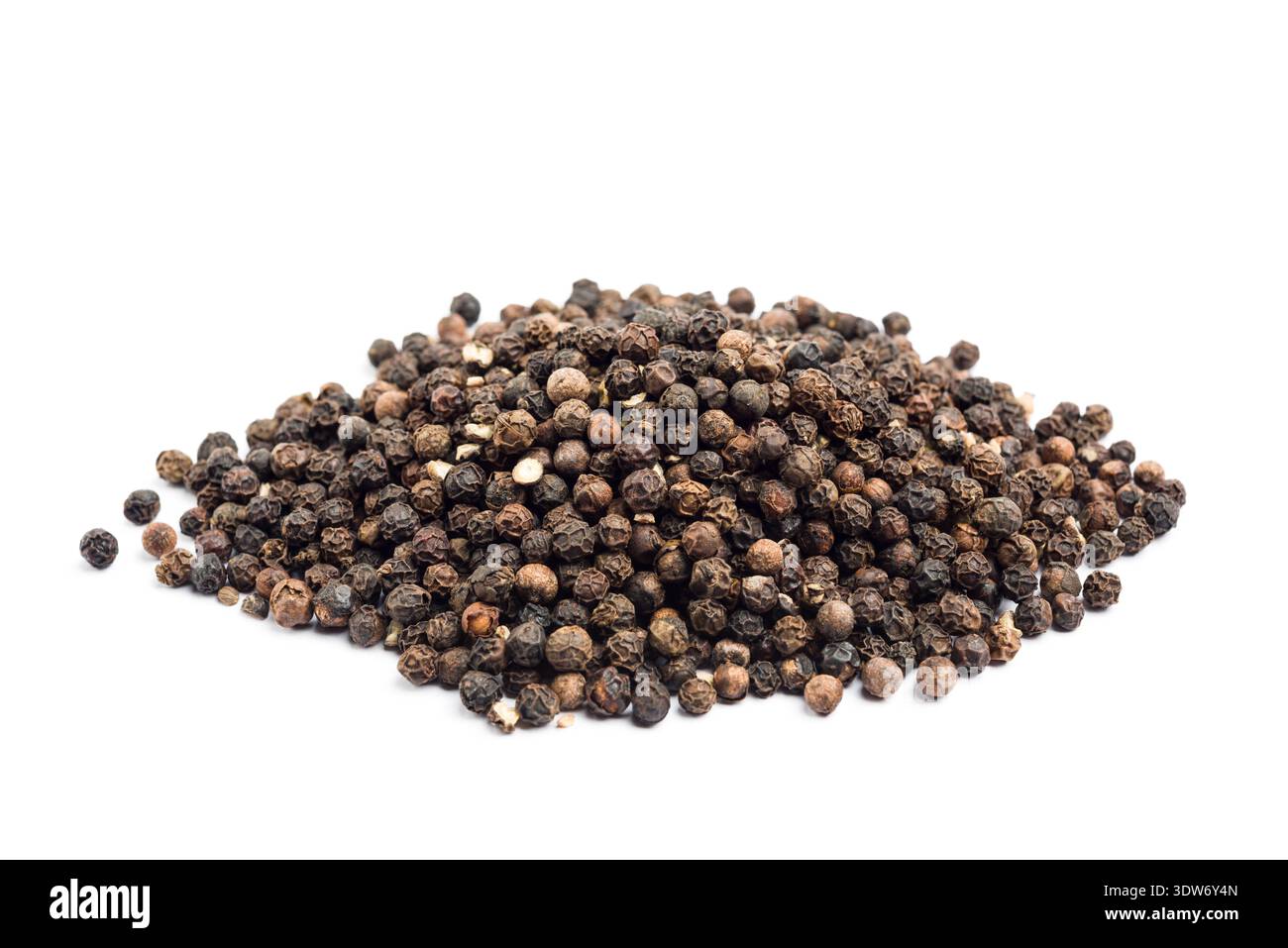 Black pepper corn pile, isolated on white background. Stock Photo