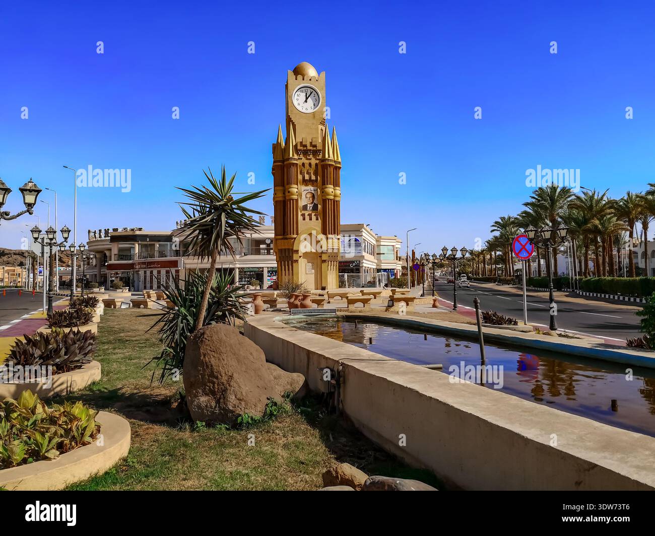 Sharm El Sheikh, Egypt - January 17, 2020: Tower with clock and a portrait of the Egyptian president among the square in the Old Market - Smartphone Captured Stock Image