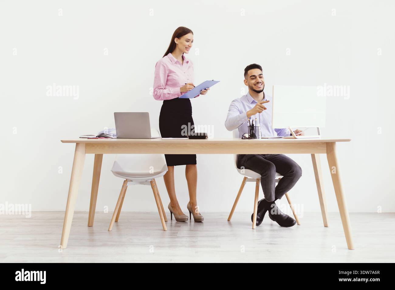 Meeting Between Two Professionals in a Modern Office Setting Stock Photo