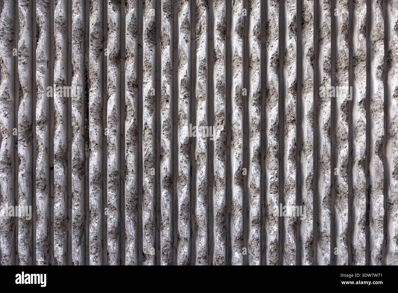 Deteriorating Concrete Wall with Cracks and Distressed Grunge Texture Background Stock Photo