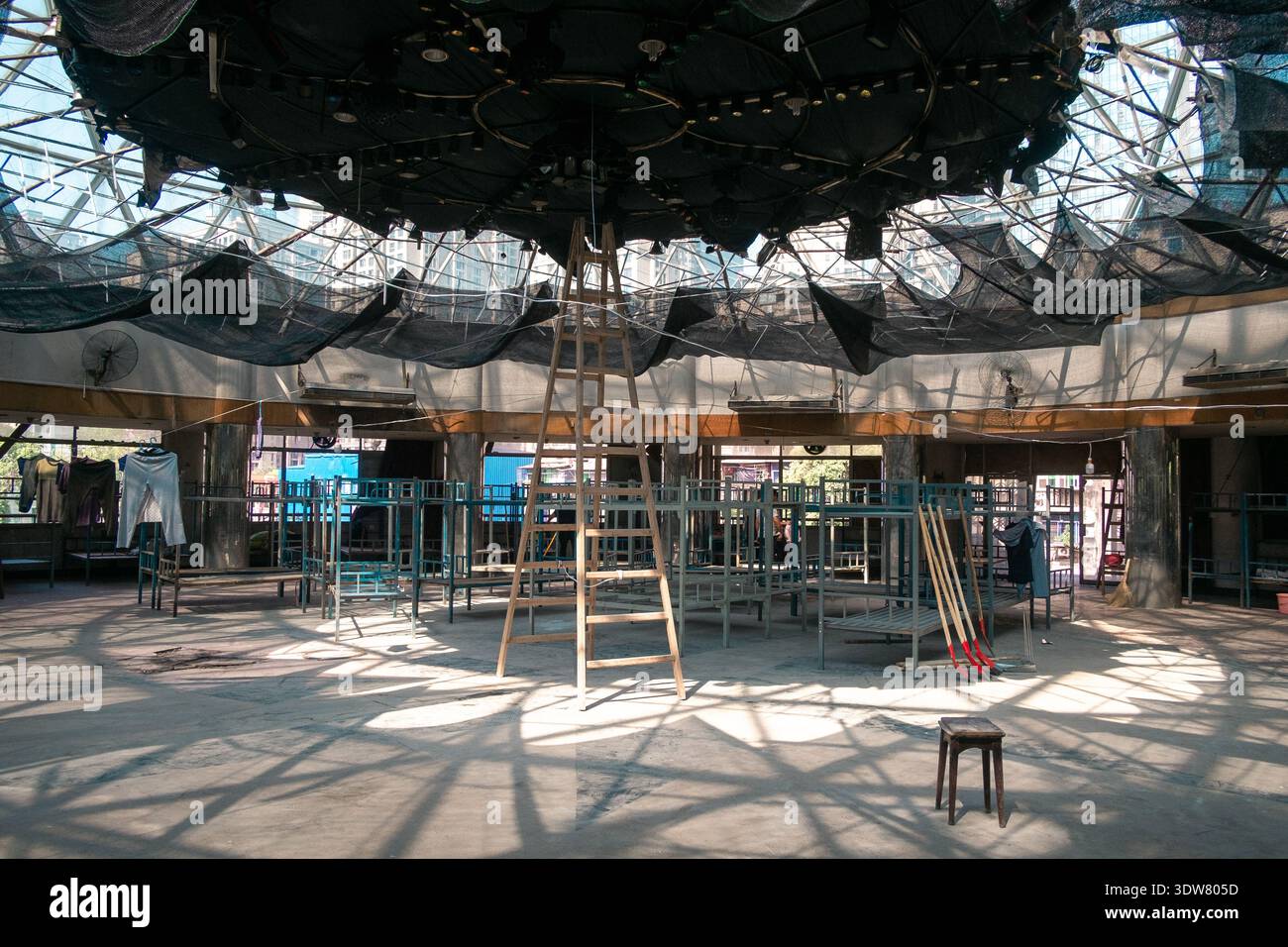 Interior view of a large atrium space under a steel and glass dome roof ...