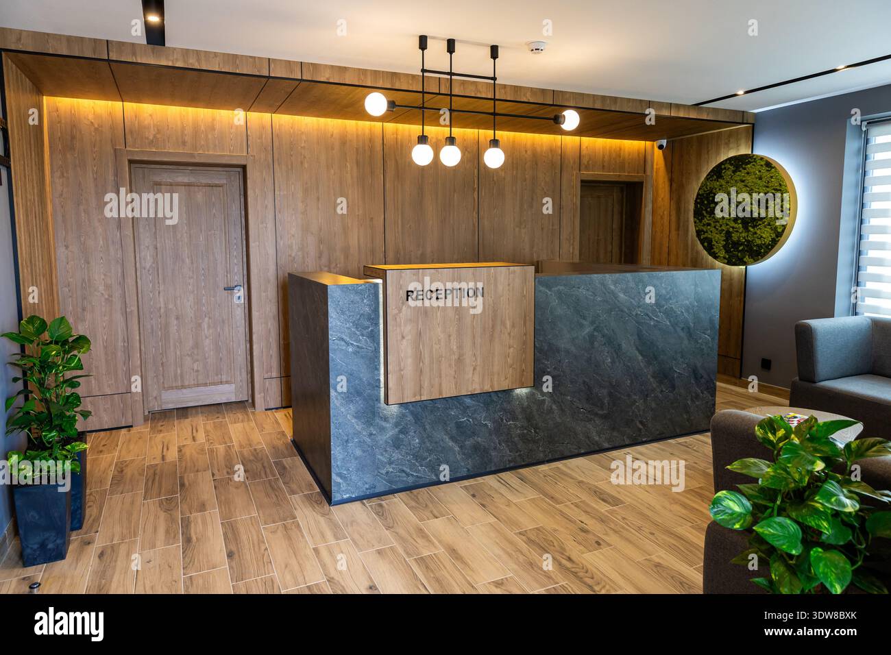 Modern hotel reception desk interior with stylish lobby design and warm ...