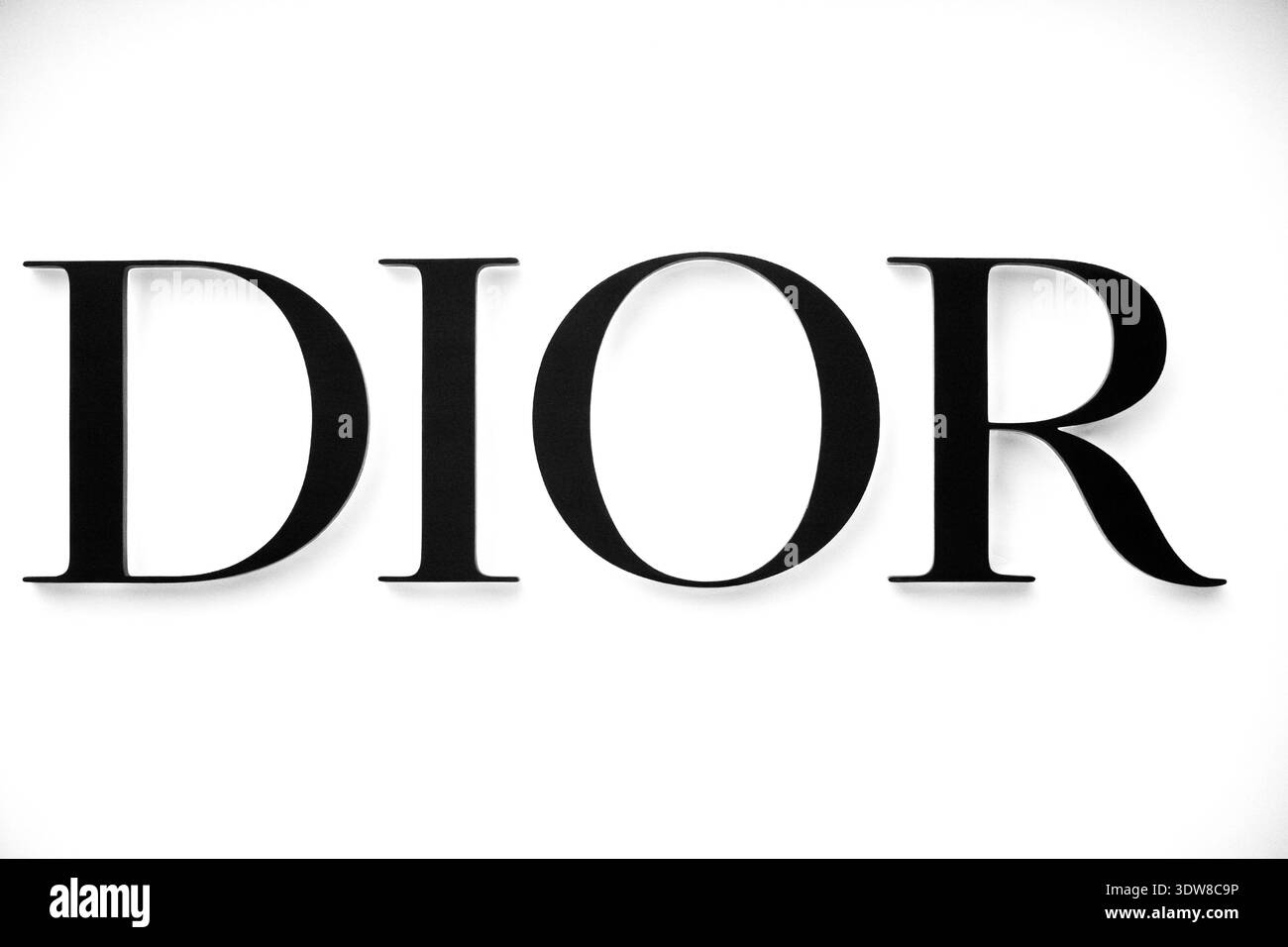Dior sign on white wall Stock Photo