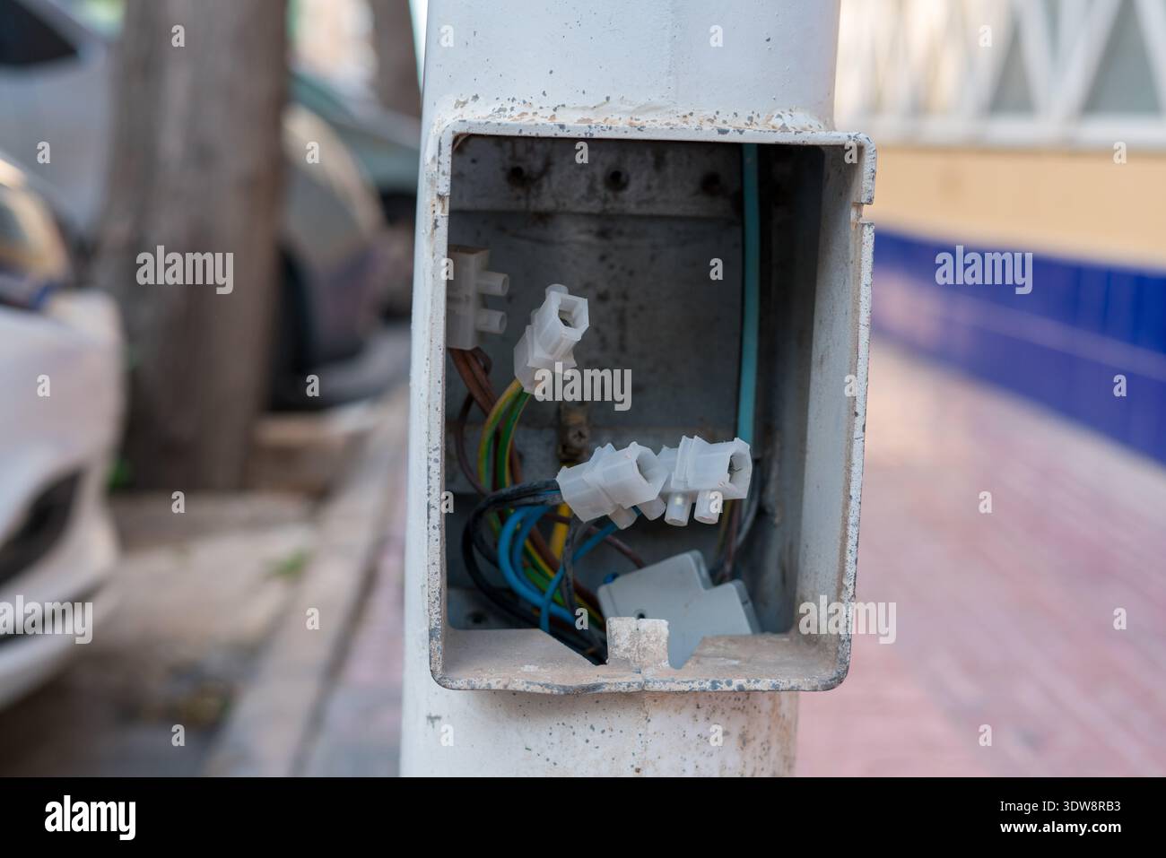 Open Electrical Junction Box with Exposed Wires Outdoors Stock Photo