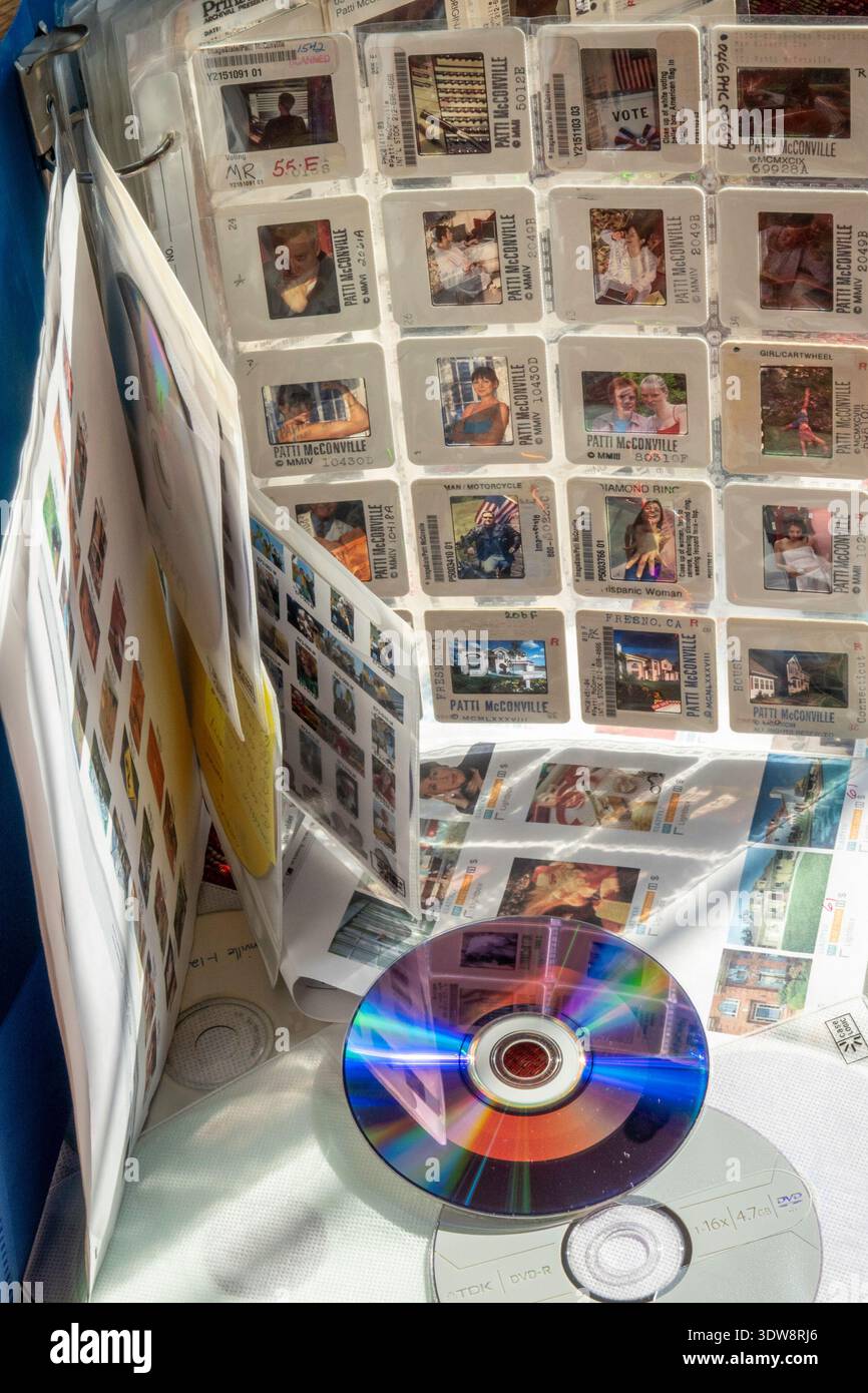 Still life of 35 mm photo slides in archival sheets and CDs with thumbnails, 2026, USA Stock Photo