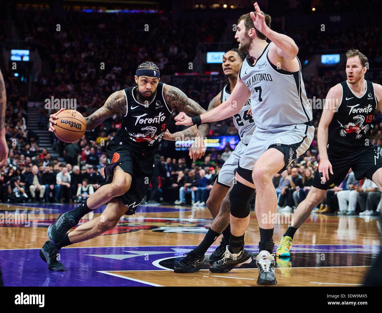Luke Raptors Toronto Raptors' Brandon Ingram (3) drives through San Antonio Spurs ...