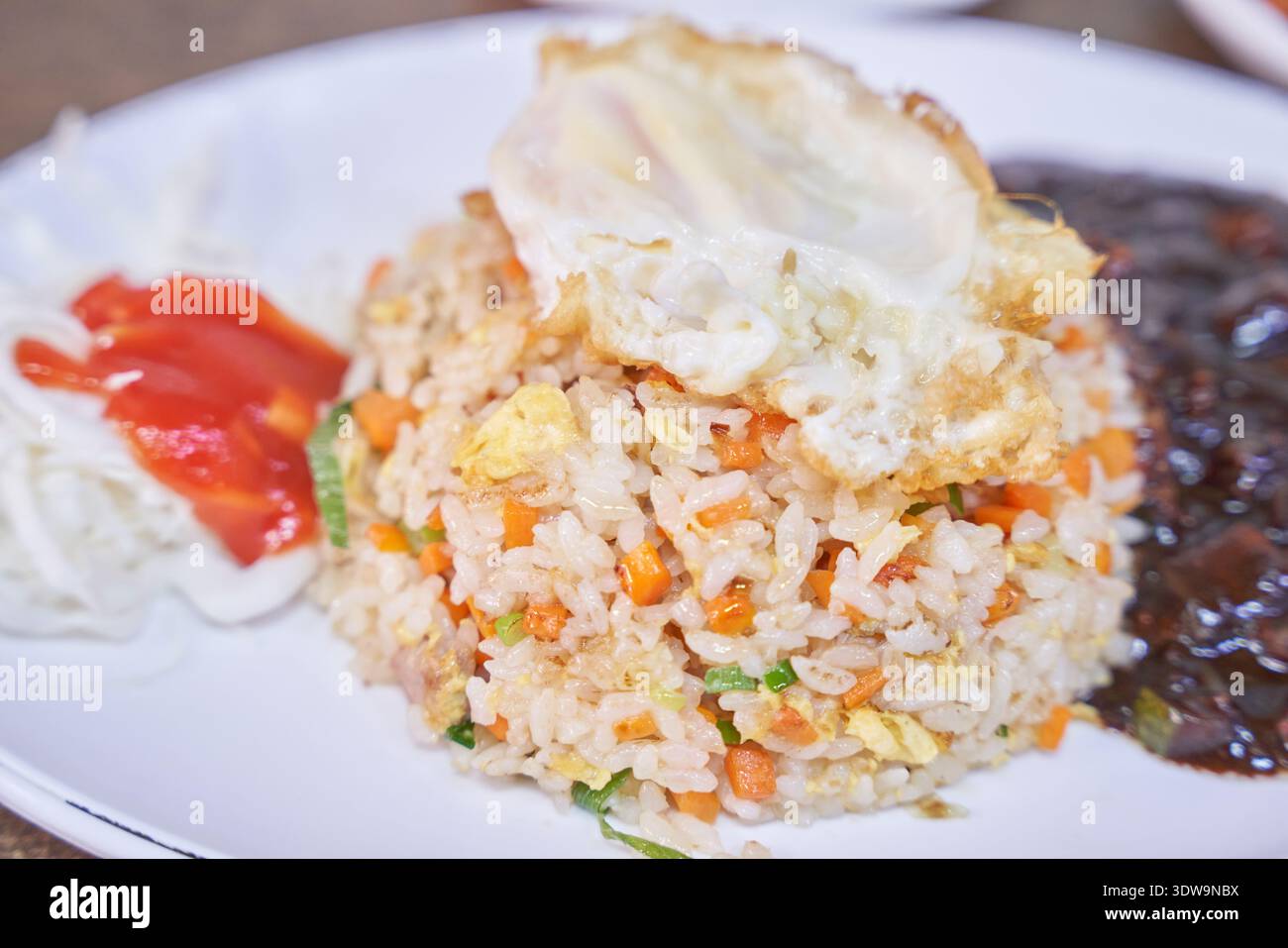 Delicious Korean-Chinese fried rice with a fried egg and black bean ...