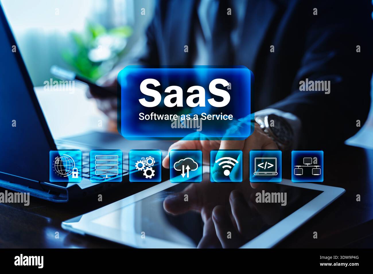 SaaS software as a service concept with businessman using laptop, smartphone and tablet. Cloud computing, subscription platform, data security, networ Stock Photo