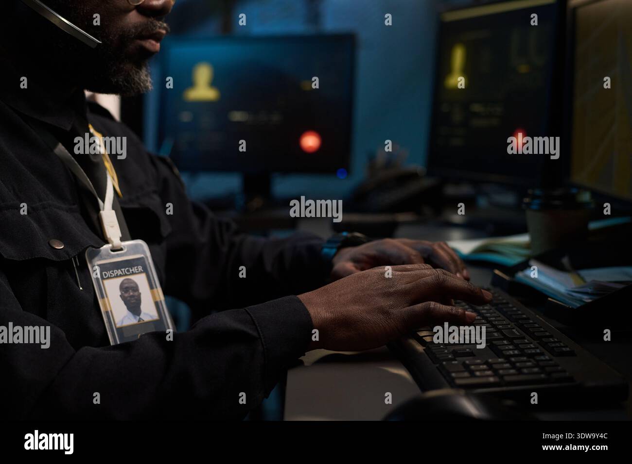 Identification Sign For Computer Monitor Black man working as dispatcher typing on computer keyboard in control ...