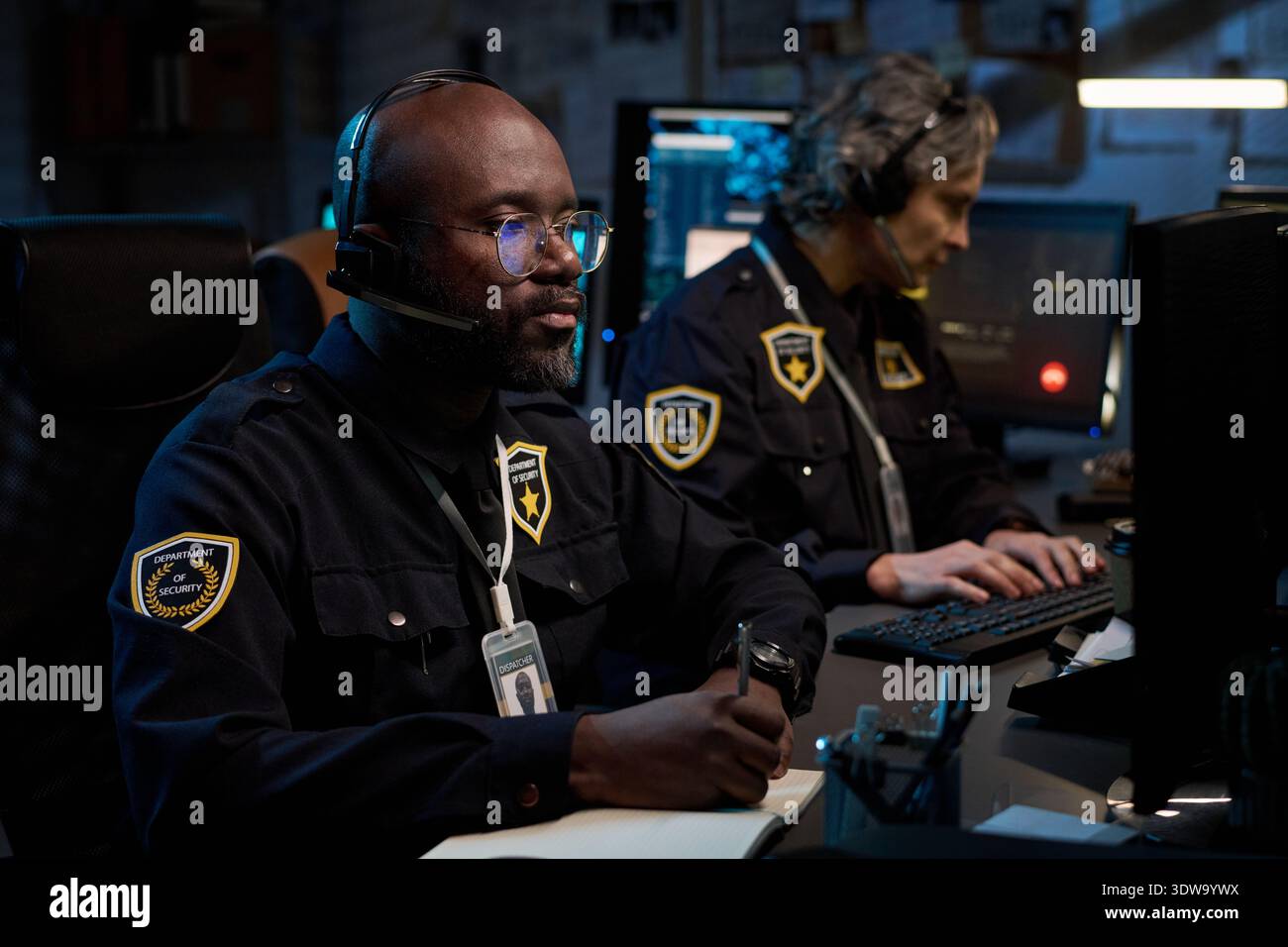 Man police badge typing hi-res stock photography and images - Alamy