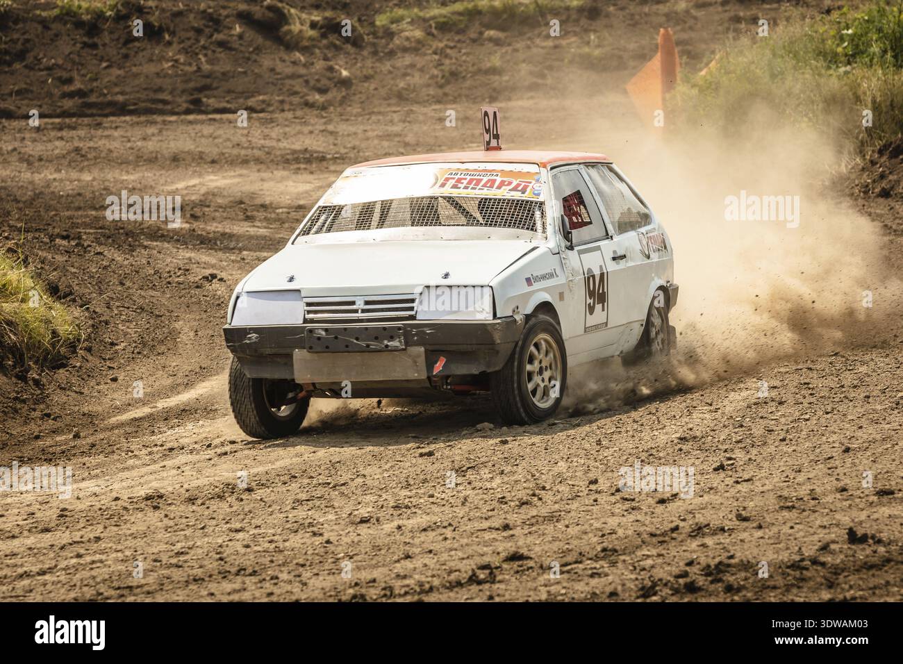 Traditional rally .The racing car drives into a steep turn, scattering ...