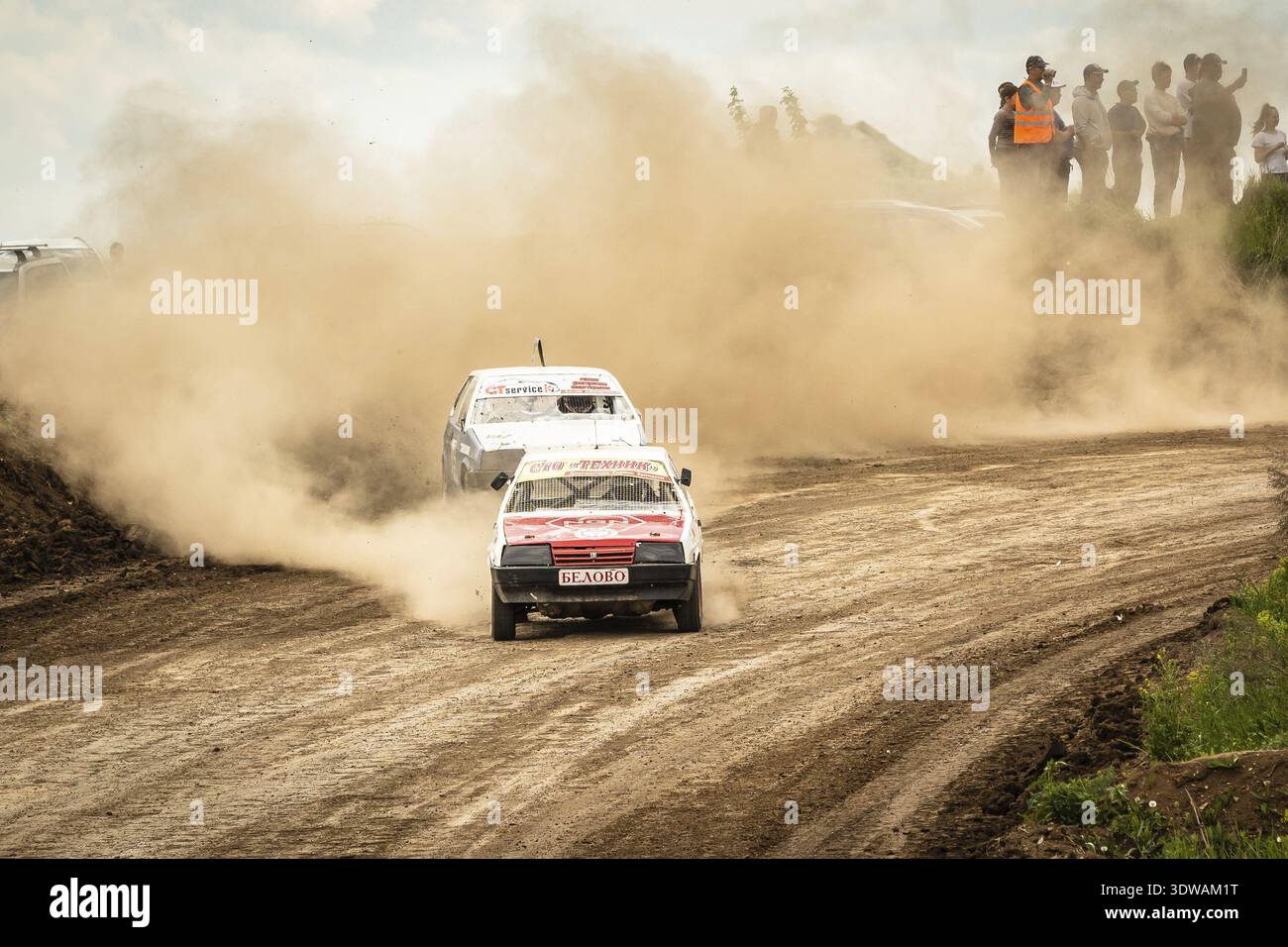 Traditional rally .The racing car drives into a steep turn, scattering ...