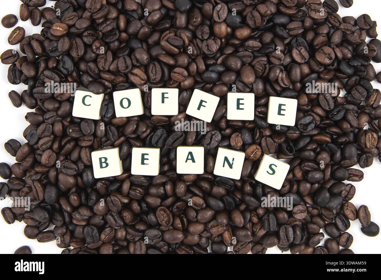 COFFEE BEANS white cube text on white background AND coffee beans background Stock Photo