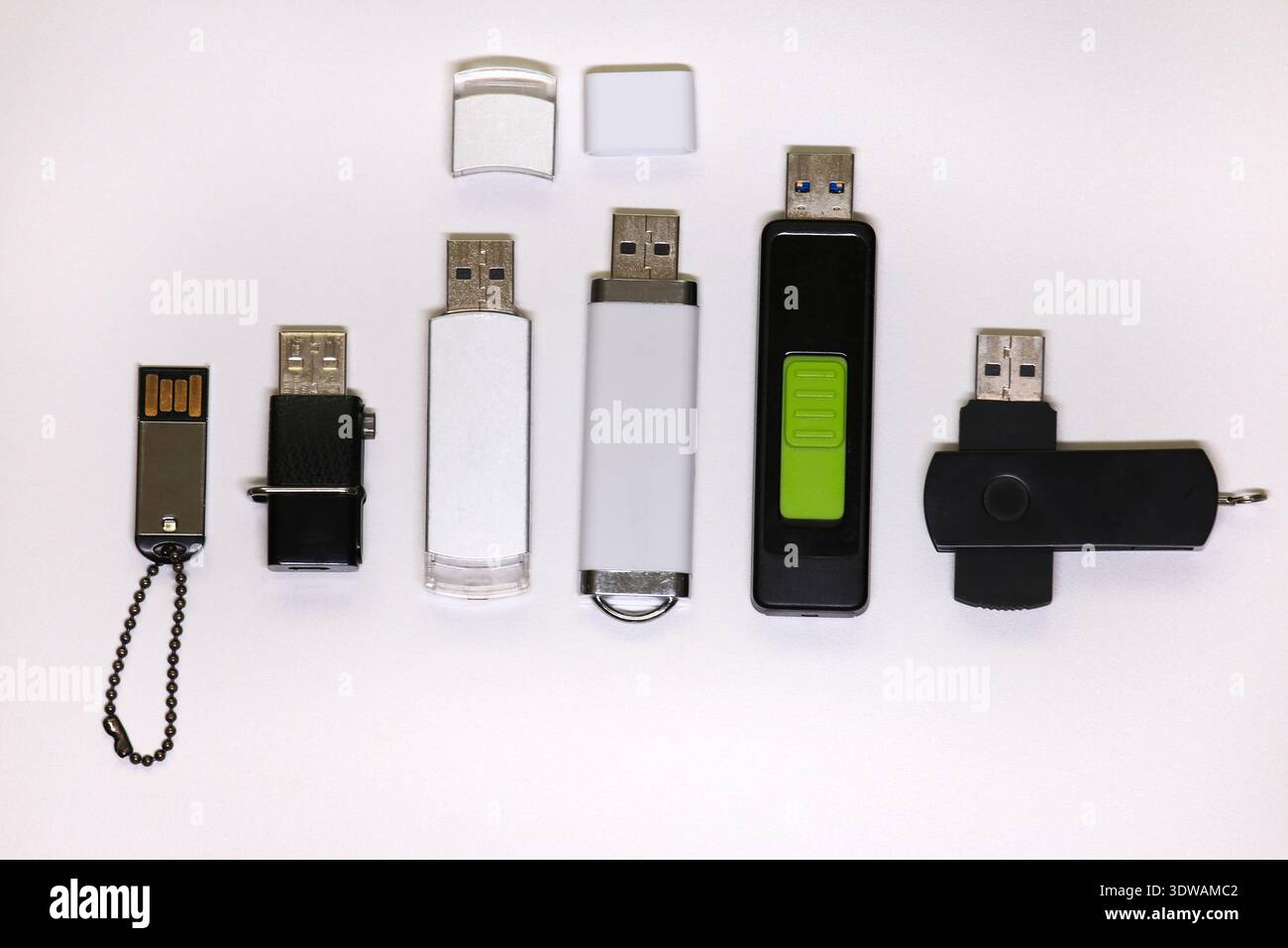 Usb Remote Matho Design A top-down view of several diverse USB flash drives, showcasing ...