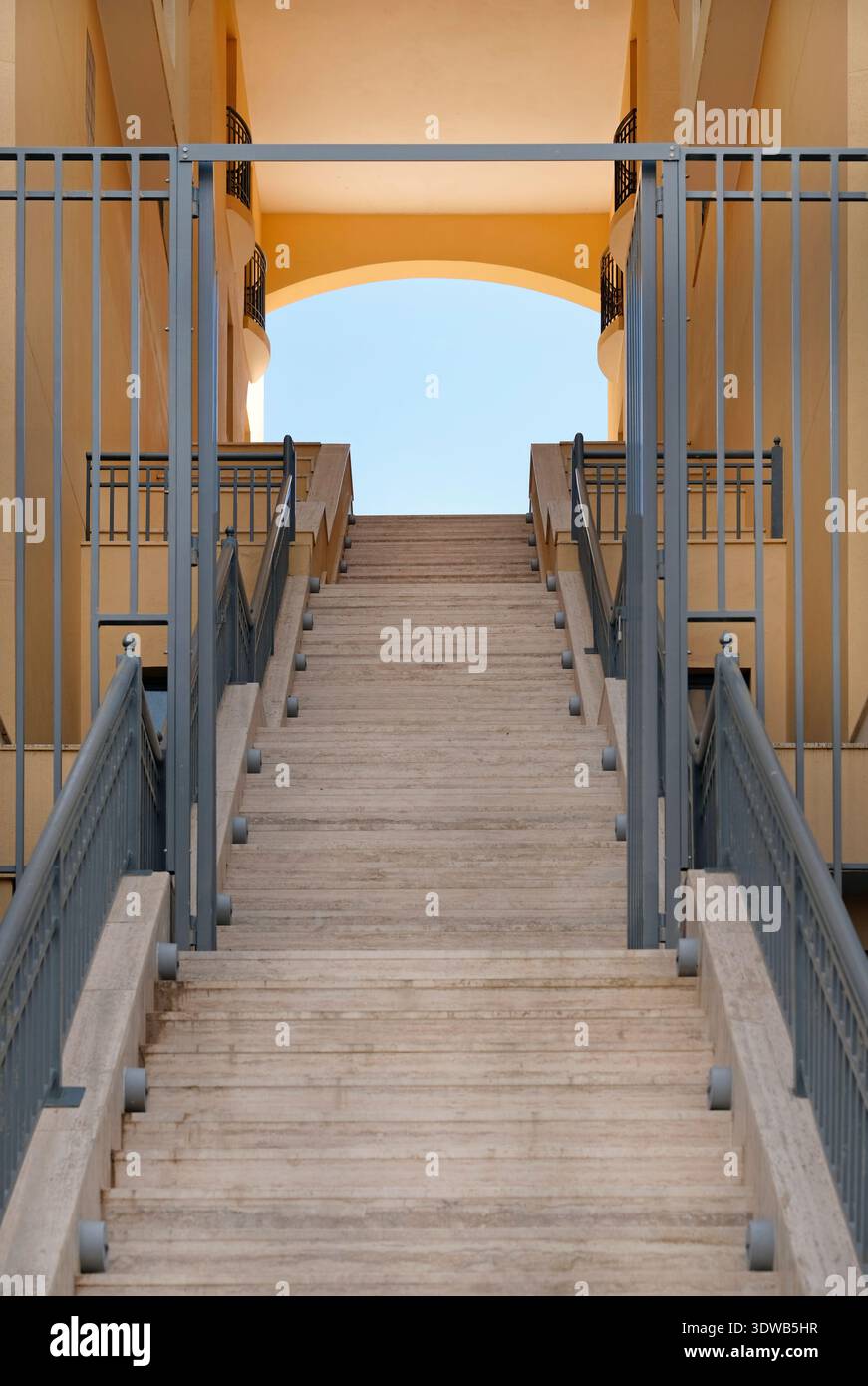 Flight of stairs leading up to a blue sky Stock Photo - Alamy