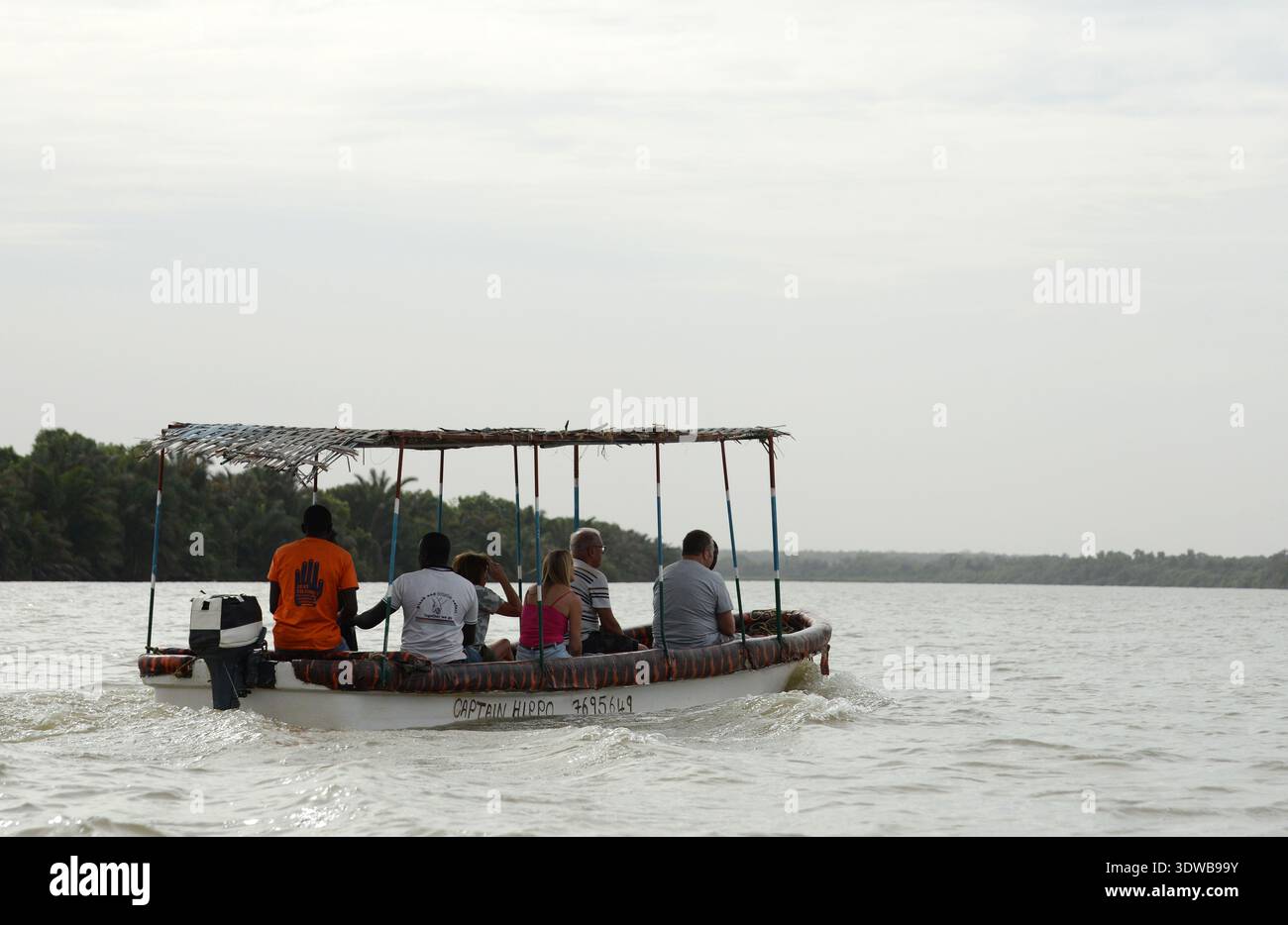 Tourist on a nature tour at the River Gambia National Park, The Gambia. Stock Photo